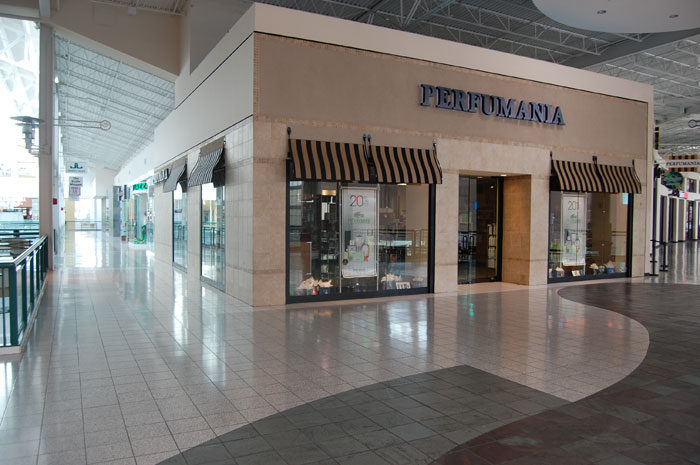 Storefront at Parks Mall with a curved tile floor pattern in front